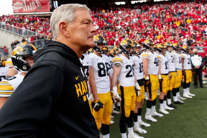 Iowa head coach Kirk Ferentz standing with his team before running out at Camp Randall Stadium in 2021.